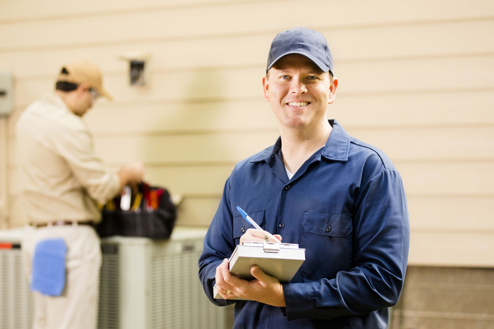 Technician with metal clipboard in hand