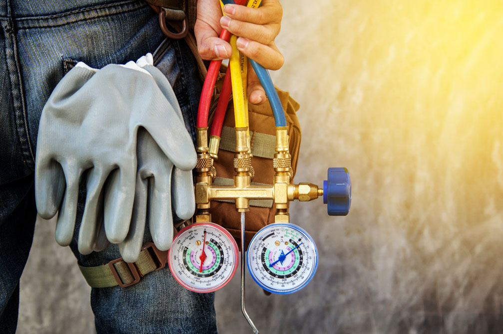 Technician with tools in hand